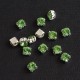 riv-0444 Риволи стеклянные круглые в цапах (светло-зеленый, 6 мм)