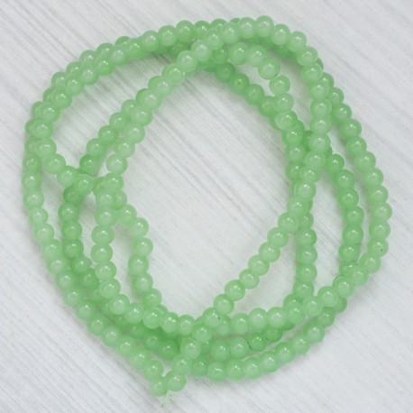 Намистини в низці (гладкі, 10 мм, блідо-салатові)